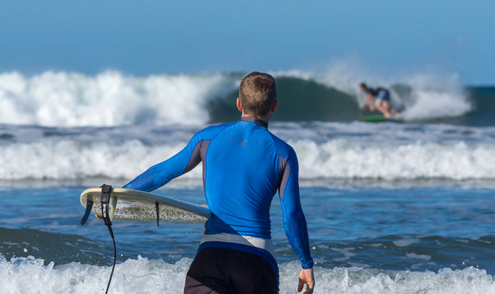 Watching surfing from shore at Playa Guiones in Costa Rica