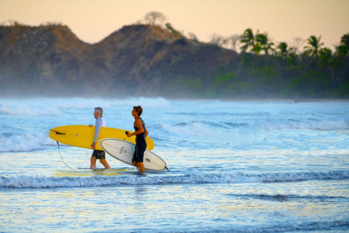 Collin Walker takes surf lesson out at Playa Guiones