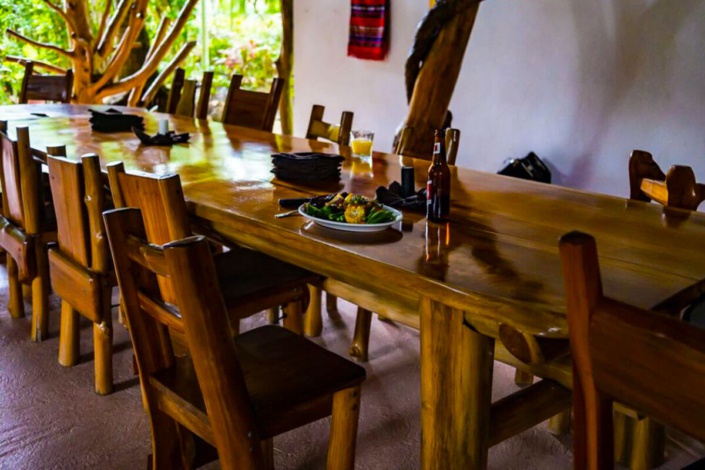 Rancho dining table with beer and lunch at Corky Carroll's Surf Resort