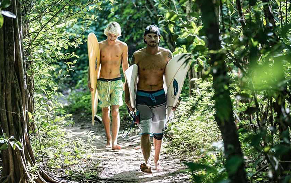 Surfers Walking in Nosara, Costa Rica